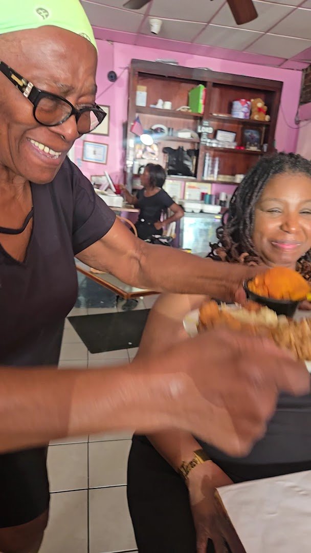 Hearty soul food dishes served in a cozy dining room.