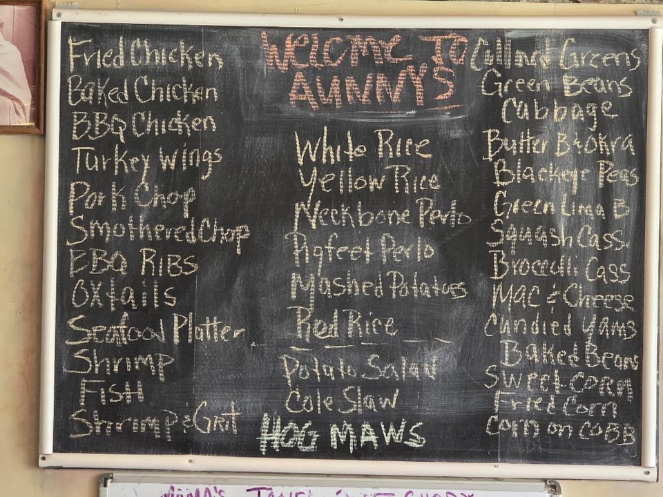 A menu spread of meat dishes and vegetables.